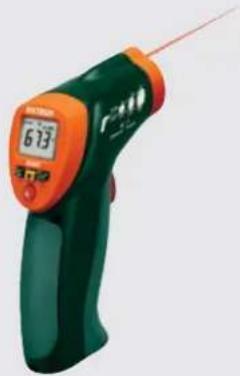 Green and orange handheld electronic device with a digital display showing 6.13 (no visible text or symbols on the device body)
