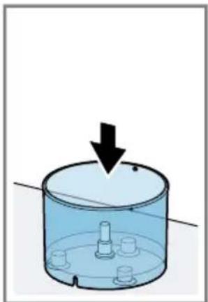 Diagram of a cylindrical container with a downward arrow indicating force or movement, no text or symbols present.