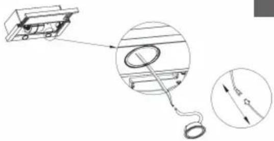 Technical diagram showing a mechanical assembly with a magnified inset of a circular component detail (no text or symbols)