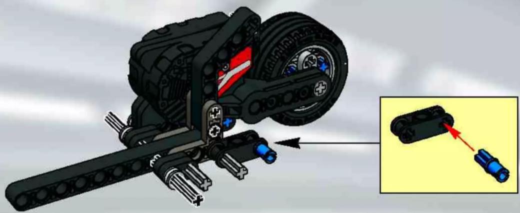 3D mechanical assembly diagram showing a vehicle with attached components and a close-up of a component being inserted (no text or symbols visible)