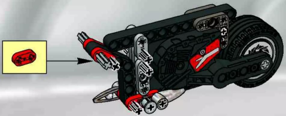 Mechanical assembly diagram showing a red and black component with gears and springs, no visible text or symbols
