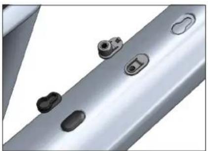 Close-up of metallic mechanical components with multiple oval features (no text or symbols visible)