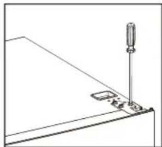 Simple line drawing of a screwdriver inserted into a component on a flat surface (no text or symbols)