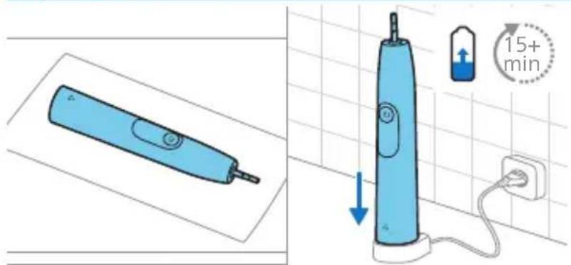 Diagram showing an electric toothbrush and its 15-minute charging station connected to a power outlet, with a magnified view of the device's charging setup.