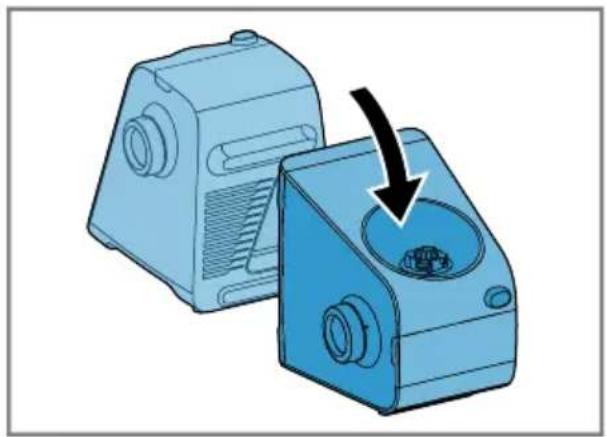 Two blue industrial cutting machines with a black arrow pointing to one (no text or symbols visible)