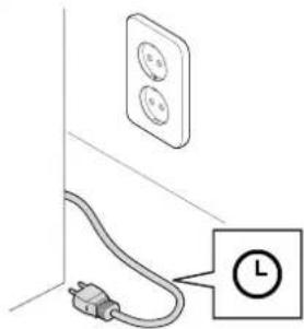 Simple line drawing of a wall-mounted electrical outlet connected to a plug, with a clock icon labeled (no text or symbols on the diagram itself)