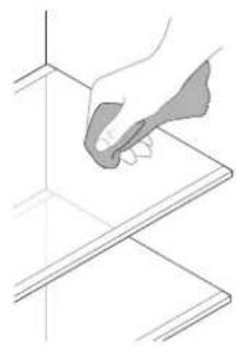 Line drawing of a hand holding a tool over a flat surface (no text or symbols)