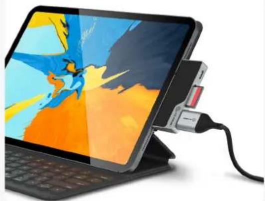 Digital tablet device with attached USB cable, showing colorful abstract wallpaper (no text or symbols visible)