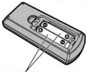 Illustration of a remote control device with buttons and a pointer (no text or symbols)