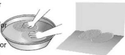 Illustration showing a hand washing a bowl with a spatula, next to a flat surface with a circular object (no text or symbols)