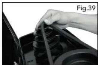Close-up of a hand holding a cable or wire inserted into a mechanical component (no visible text or symbols)