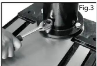 Close-up of a hand using a wrench to work on a mechanical component (no visible text or symbols)