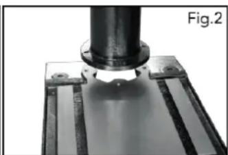 Close-up of a mechanical component with a cylindrical shaft and flange, labeled Fig.2 (no text or symbols on the object itself)