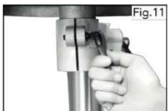 Close-up of a hand holding a mechanical component, possibly a tool or device, with no visible text or symbols.