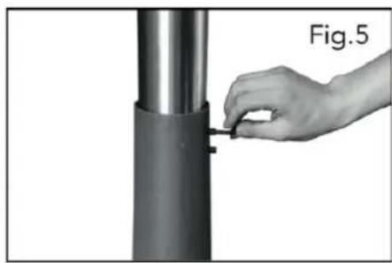 Hand inserting a small component into a cylindrical metal component, labeled Fig.5 (no text or symbols on the object itself)