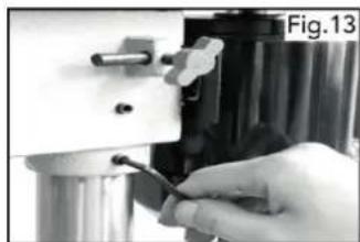 Close-up of a hand holding a tool, partially enclosed in a mechanical device (no visible text or symbols)