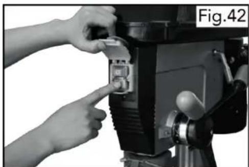 Close-up of hands installing or adjusting a camera module with a button (no visible text or symbols)