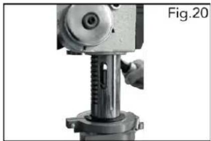 Close-up of a mechanical press or drill bit with a hand operating the tool (no visible text or symbols)
