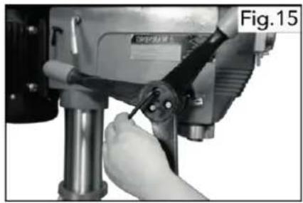 Close-up of a hand using a drill bit on a machine, no visible text or symbols