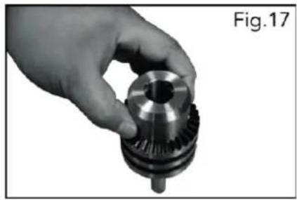 Hand holding a mechanical gear component, labeled Fig.17 (no text on the gear itself)