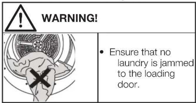 WARNING! • Ensure that no laundry is jammed to the loading door.