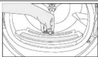 Line drawing of a person pressing down on a circular mechanical component (no text or symbols)