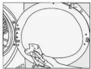Line drawing of a hand cleaning a circular mechanical component (no text or symbols)