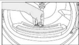 Line drawing of a person standing on a circular platform with a fan in the background (no text or symbols)