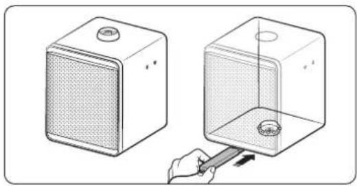 Illustration of a two-step device with a mesh chamber and a hand holding a tool, showing internal components (no text or symbols)