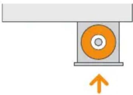 Diagram of a mechanical assembly with an orange circular component and an upward arrow, no text or symbols present.