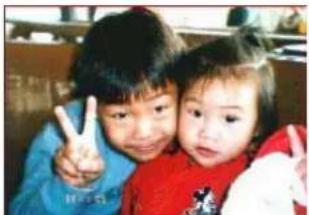 Two children posing with a peace sign (no visible text or symbols)
