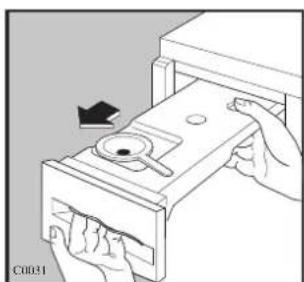 Illustration of hands inserting a device into a drawer with a handle (no text or symbols)