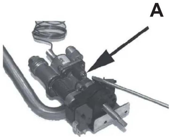 Mechanical component with attached wires and a labeled arrow (A), no visible text or symbols beyond the label.