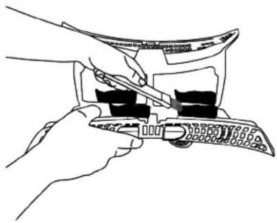 Line drawing of hands using a tool to adjust or install a device (no text or symbols visible)