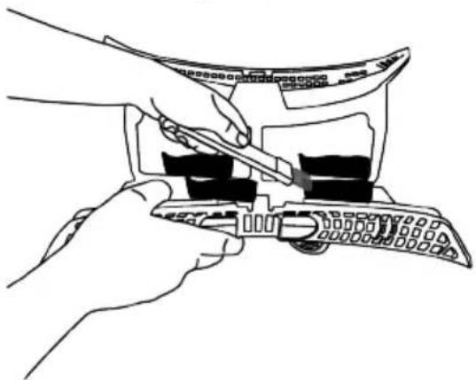 Line drawing of hands using a tool to adjust or install a mechanical component (no text or symbols visible)