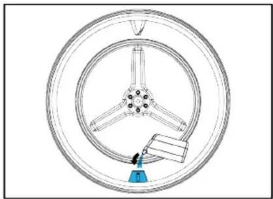 Technical line drawing of a wheel assembly with a blue tool at the center (no text or symbols)