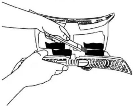 Line drawing of two hands using a tool to adjust or install a mechanical component (no text or symbols present)
