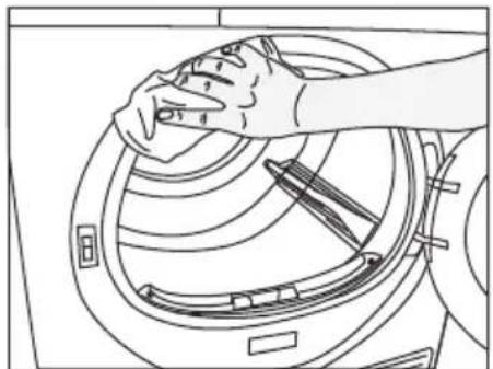 Line drawing of a hand cleaning a washing machine with tools (no text or symbols)