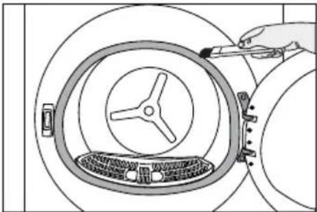 Diagram of a hand using a tool to clean or inspect the interior of a large circular device (no text or symbols visible)