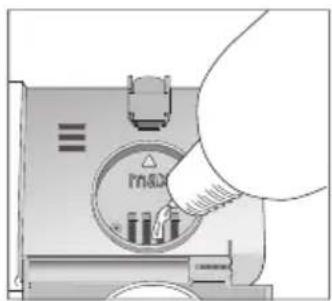 Hand inserting a device into a control panel with indicator lights (no text or symbols visible)