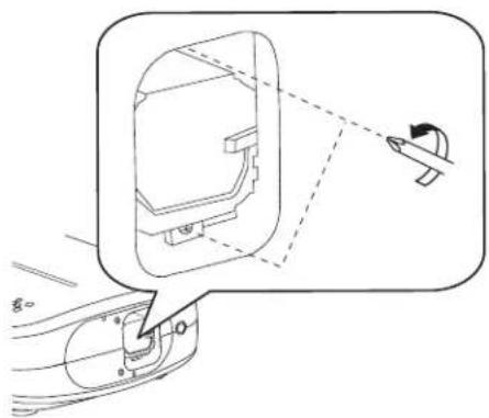 Technical diagram showing a car interior with a magnified view of the door panel and a small directional arrow indicating motion.