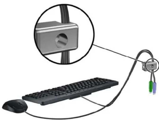 Diagram showing a computer keyboard connected to a mouse via cable, with an inset close-up of a mechanical component (no text or symbols)