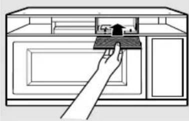 Line drawing of a hand placing a tray into a microwave oven (no text or symbols)