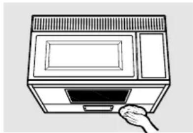Line drawing of a microwave oven with a hand inserting a tray (no text or symbols)