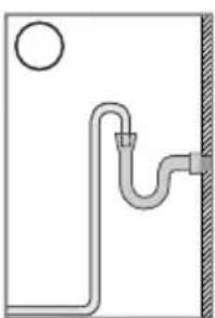 Simple line drawing of a pipe with a circular outlet and a vertical wall (no text or symbols)