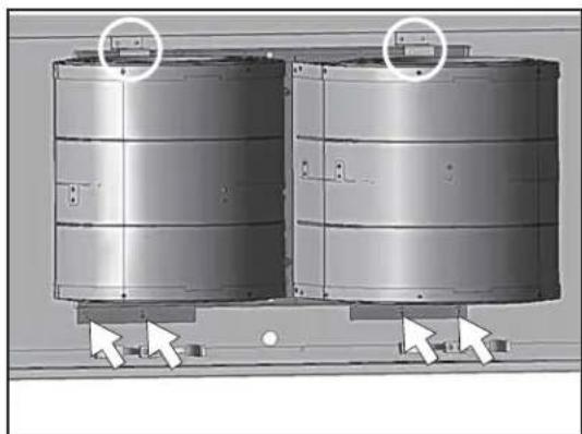 Two metallic cylindrical tanks mounted on a base, with arrows pointing to the side of each tank (no text or symbols visible)