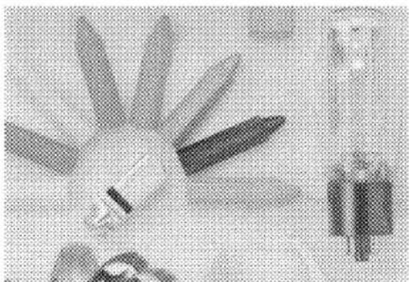 Illustration of a person holding a large object with multiple blades, possibly a tool or device (no text or symbols visible)