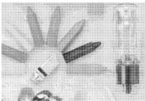 Black-and-white photo of a hand holding a pen, with abstract background elements and no visible text or symbols.