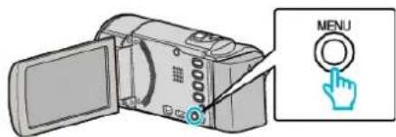 Diagram showing a digital camera with an open lid and a 'MENU' button, likely illustrating a camera menu interface.