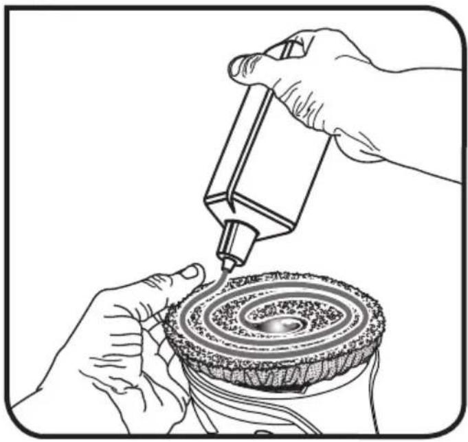 Illustration of hands using a tool to apply material to a circular component (no text or symbols present)
